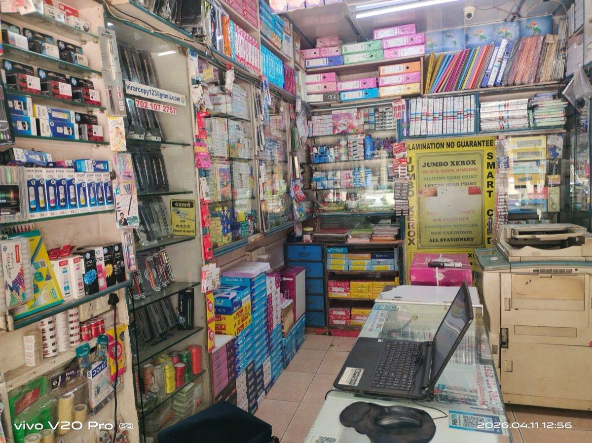 Inside the shop showing the main Xerox machine and customer service counter